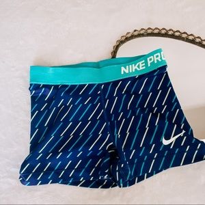 Neon blue and green Nike Pros